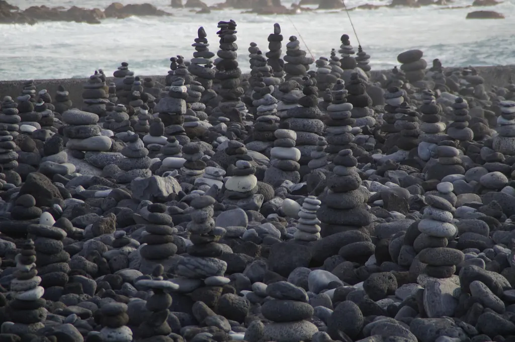 several stacks of rocks with a water body in the background--teacher training