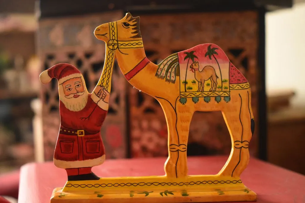 a paper-mache figurine of Santa Claus and a camel--paper-mache in Kashmir