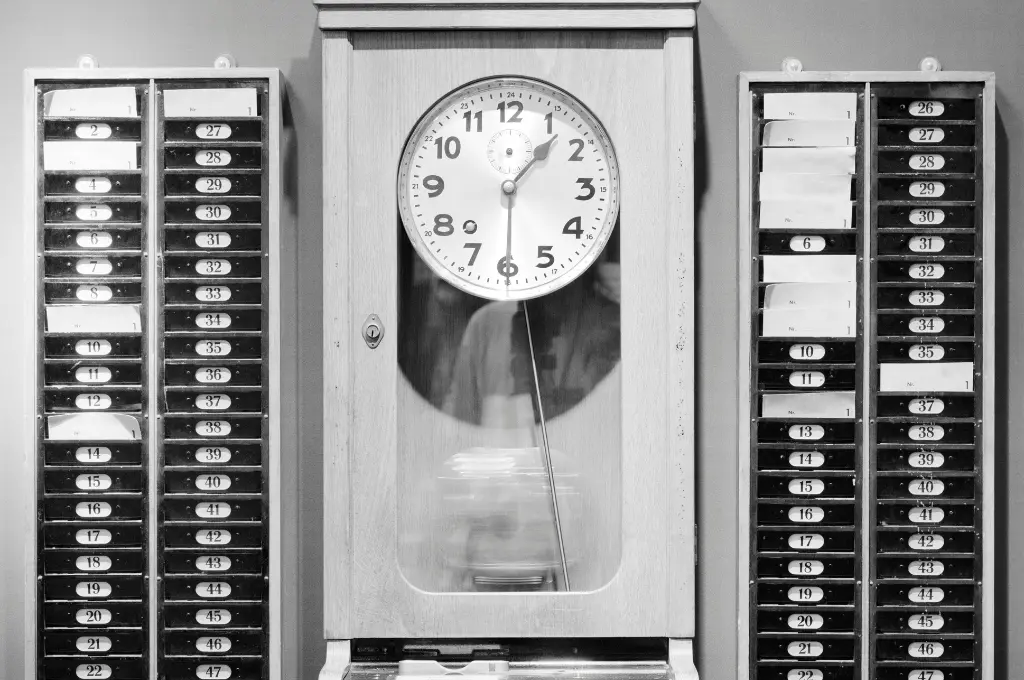 a black and white photo of a wall clock--nonprofit humour