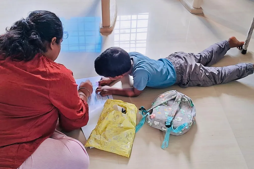 A woman teaching a child how to draw--social-emotional learning