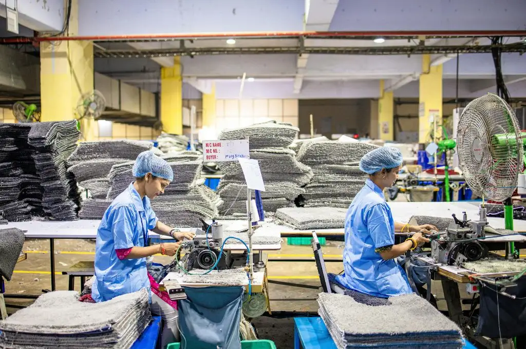 textile factory workers sewing in a production facility--DDU GKY scheme