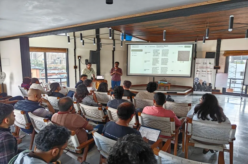 two speakers making a presentation before a group of people--cohort based learning