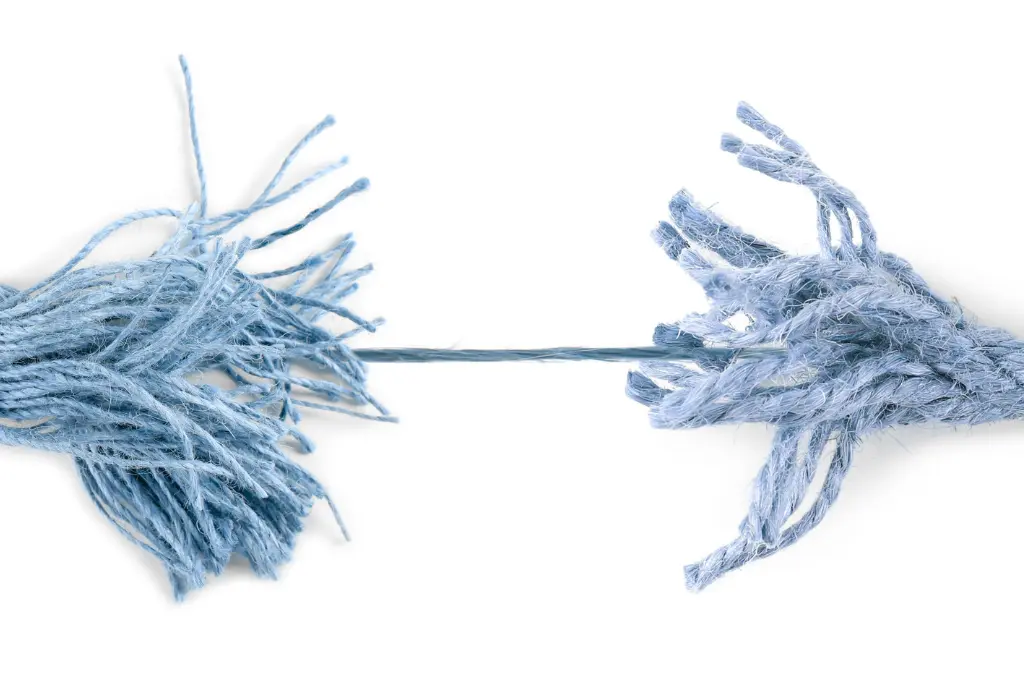 a frayed blue rope with only a few strands connecting the two ends--nonprofit humour