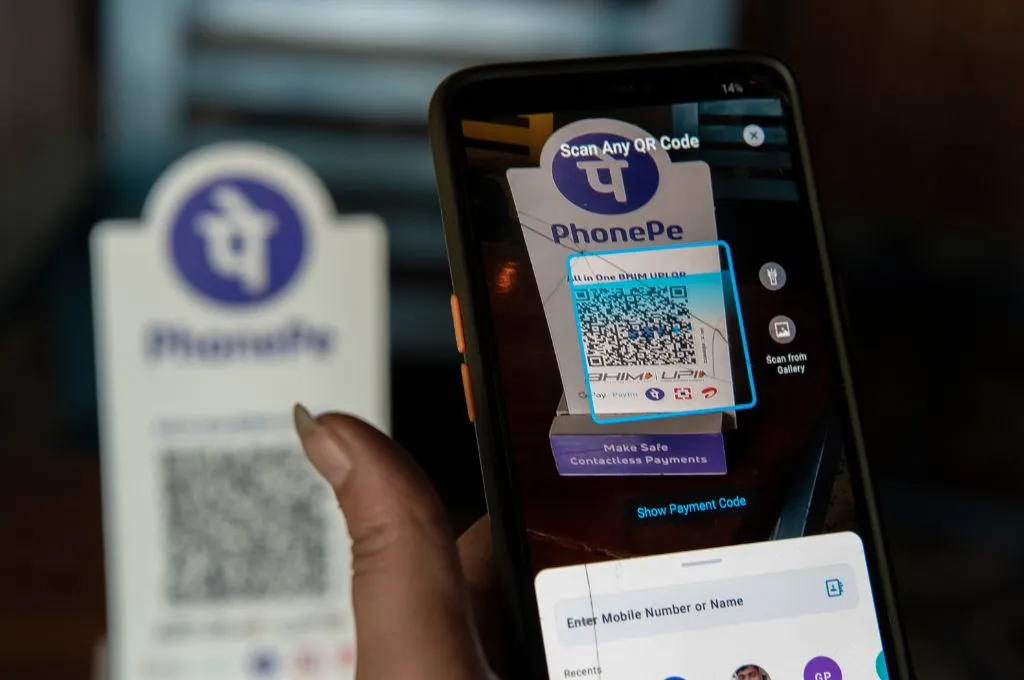 A close up of a smartphone scanning a UPI QR code--digital banking