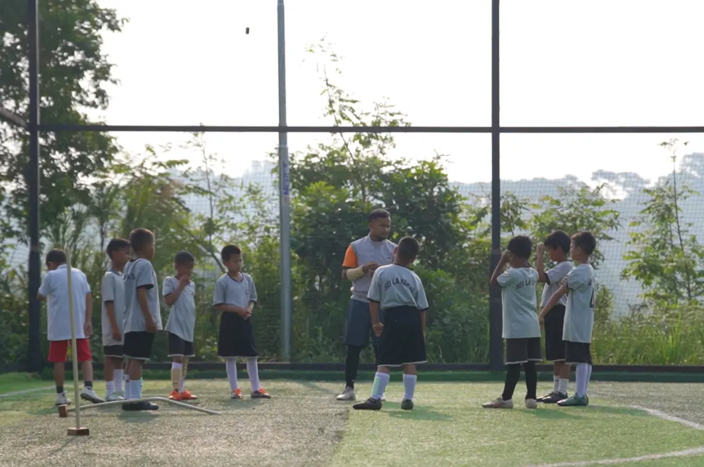 a man coaching a boys' football team--Shillong football club