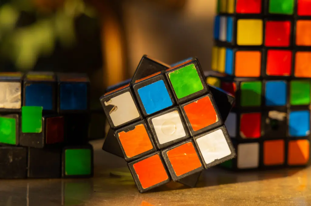 close up shpt of four rubik's cubes set on a table--funding AI