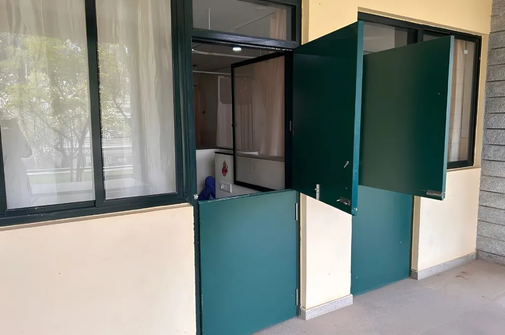 two green doors with the top halves open--hospice facilities
