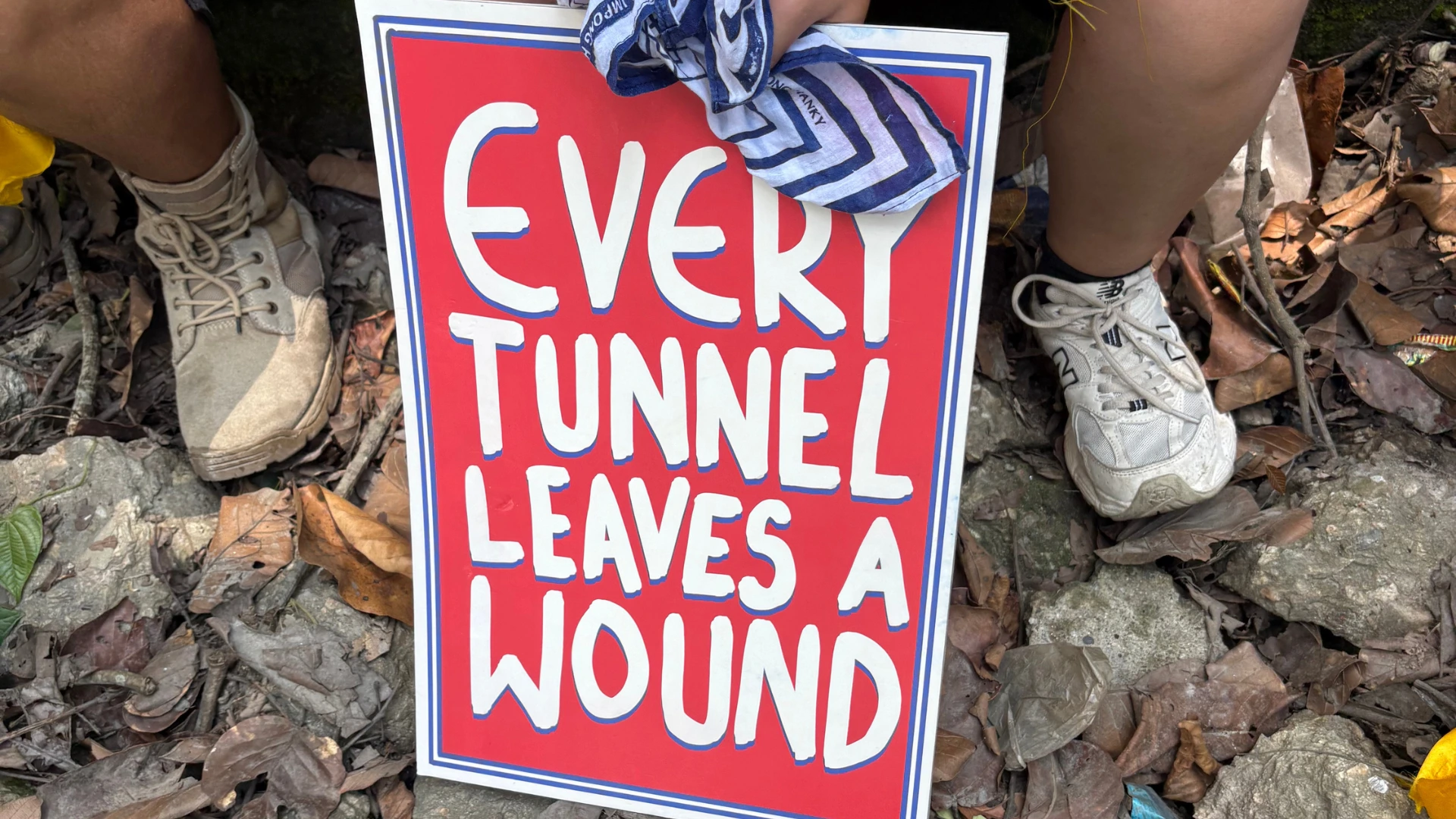 a placard with the text 