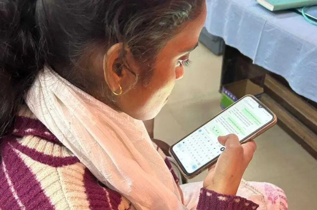 close-up shot of a young woman interacting with a WhatsApp chatbot--AI for health