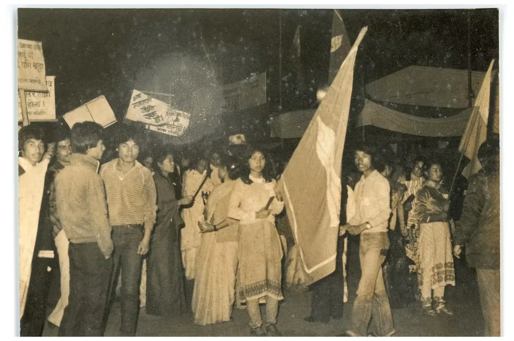 a black and white photo of young people holding flags and placards and protesting--photo archive