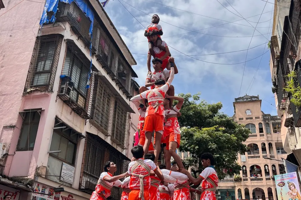 A human pyramid celebration during the Dahi Handi festival in Mumbai--social sector India